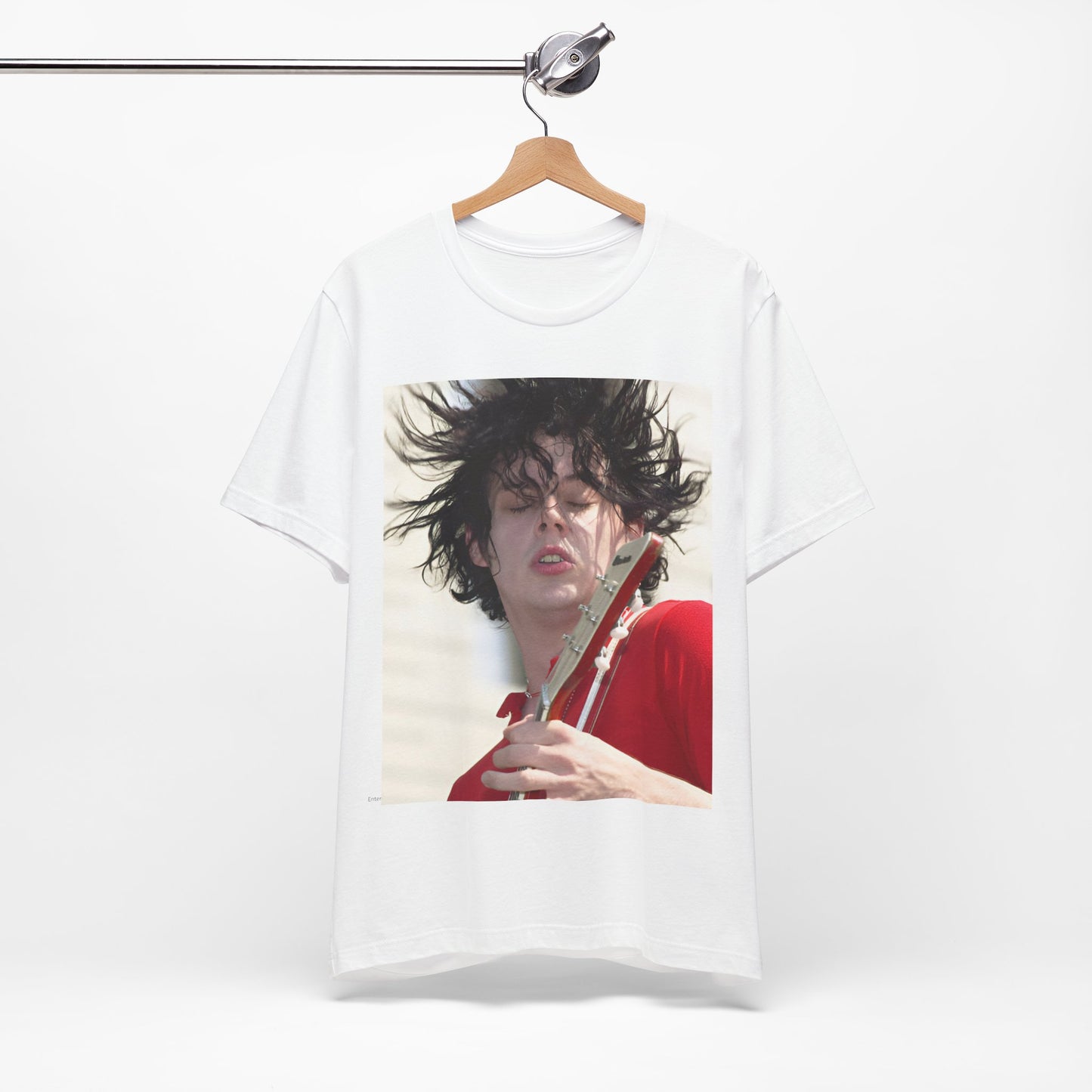 A black graphic t-shirt featuring a retro graphic of Jack White from The White Stripes playing guitar.