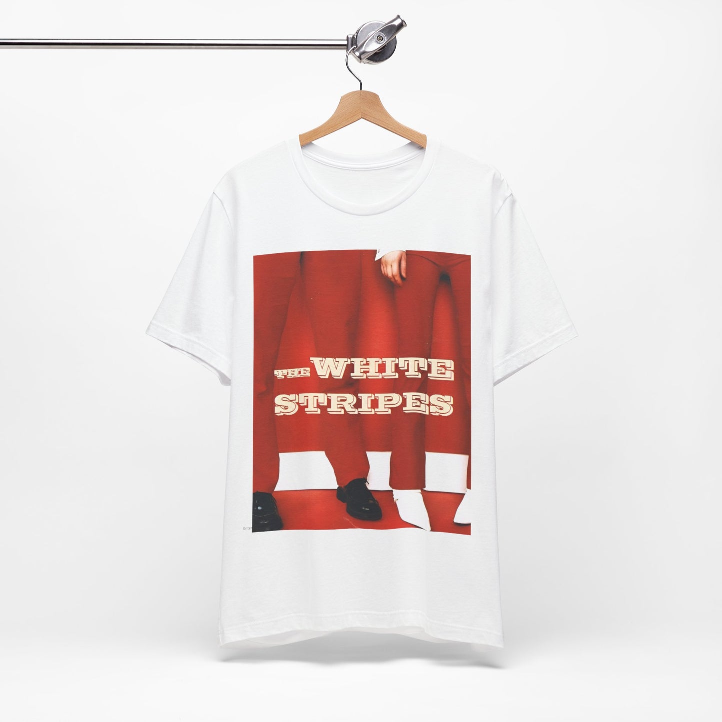 A black graphic t-shirt featuring a red and white signature graphic of The White Stripes.