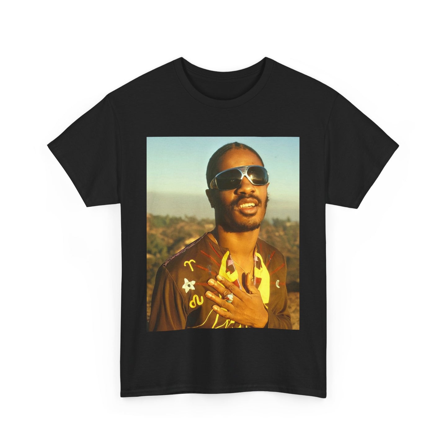 A black graphic t-shirt featuring a 70s cool musical genius graphic of Stevie Wonder.