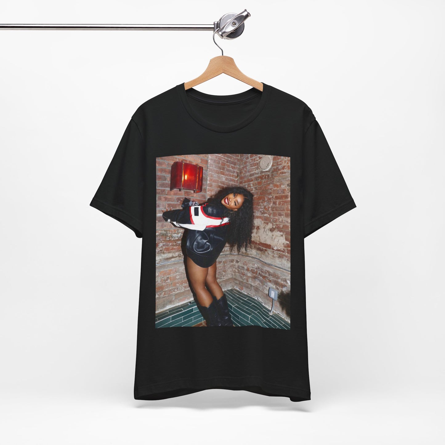 A black graphic t-shirt featuring a graphic of SZA as a TDE Queen R&B icon.
