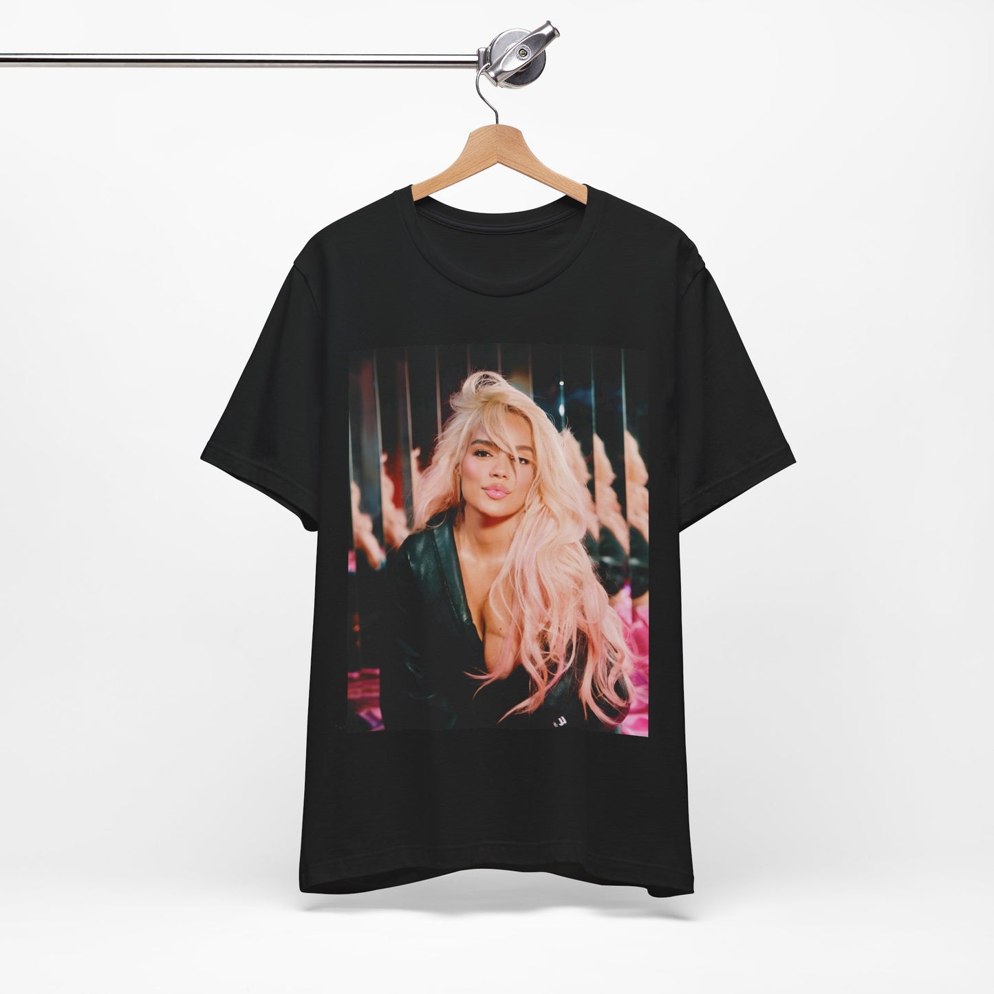 A black graphic t-shirt featuring a graphic of Karol G as an empowered Latina icon.