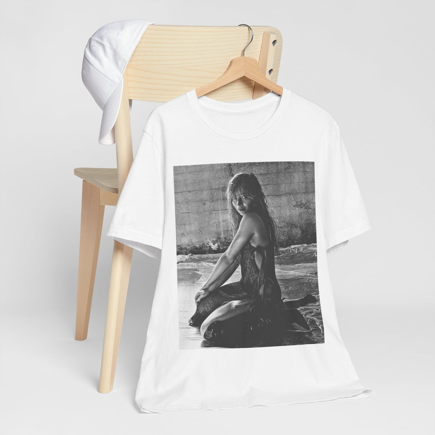 A black graphic t-shirt featuring a black and white, monochrome graphic or photo of Sabrina Carpenter.