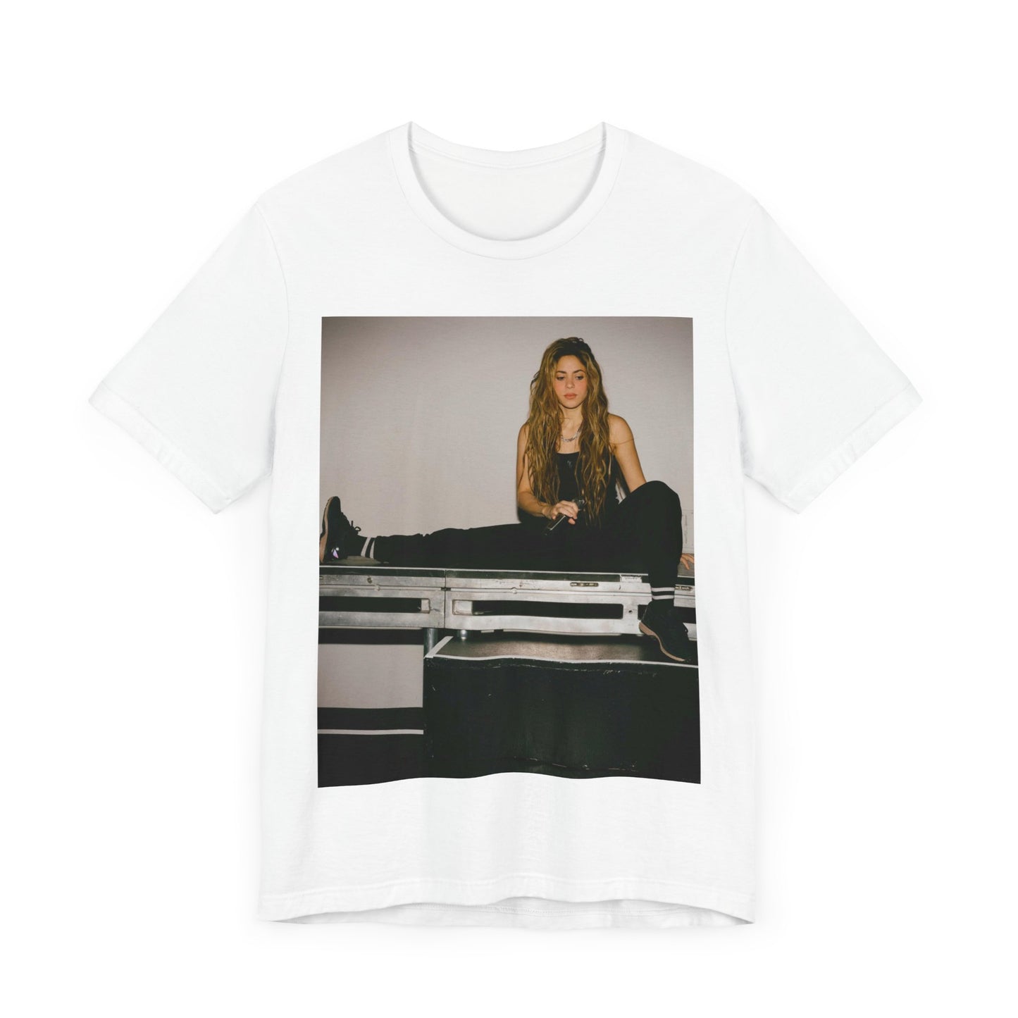A black graphic t-shirt featuring a modern pop essential graphic of Shakira.