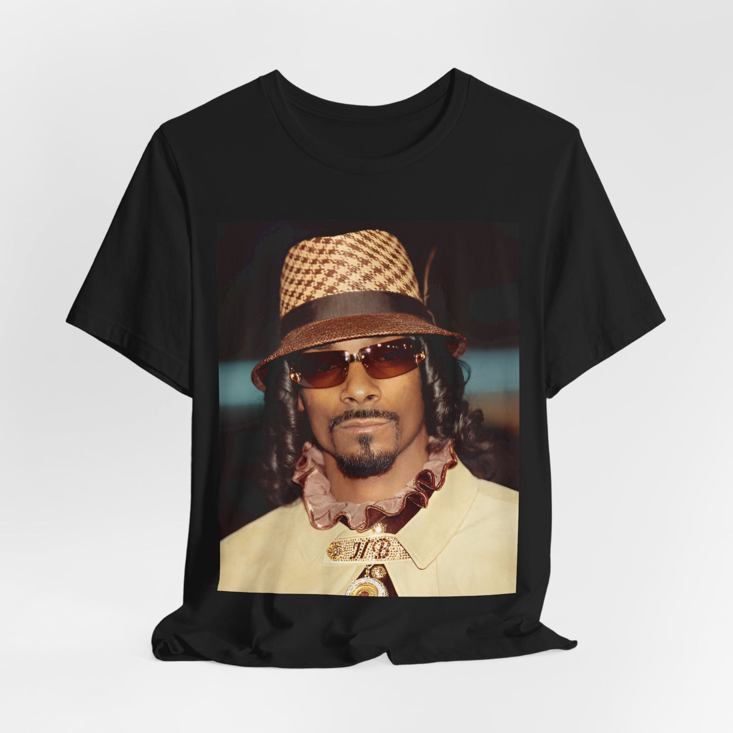 A black graphic t-shirt featuring a glamorous graphic of Snoop Dogg as a Doggfather icon.