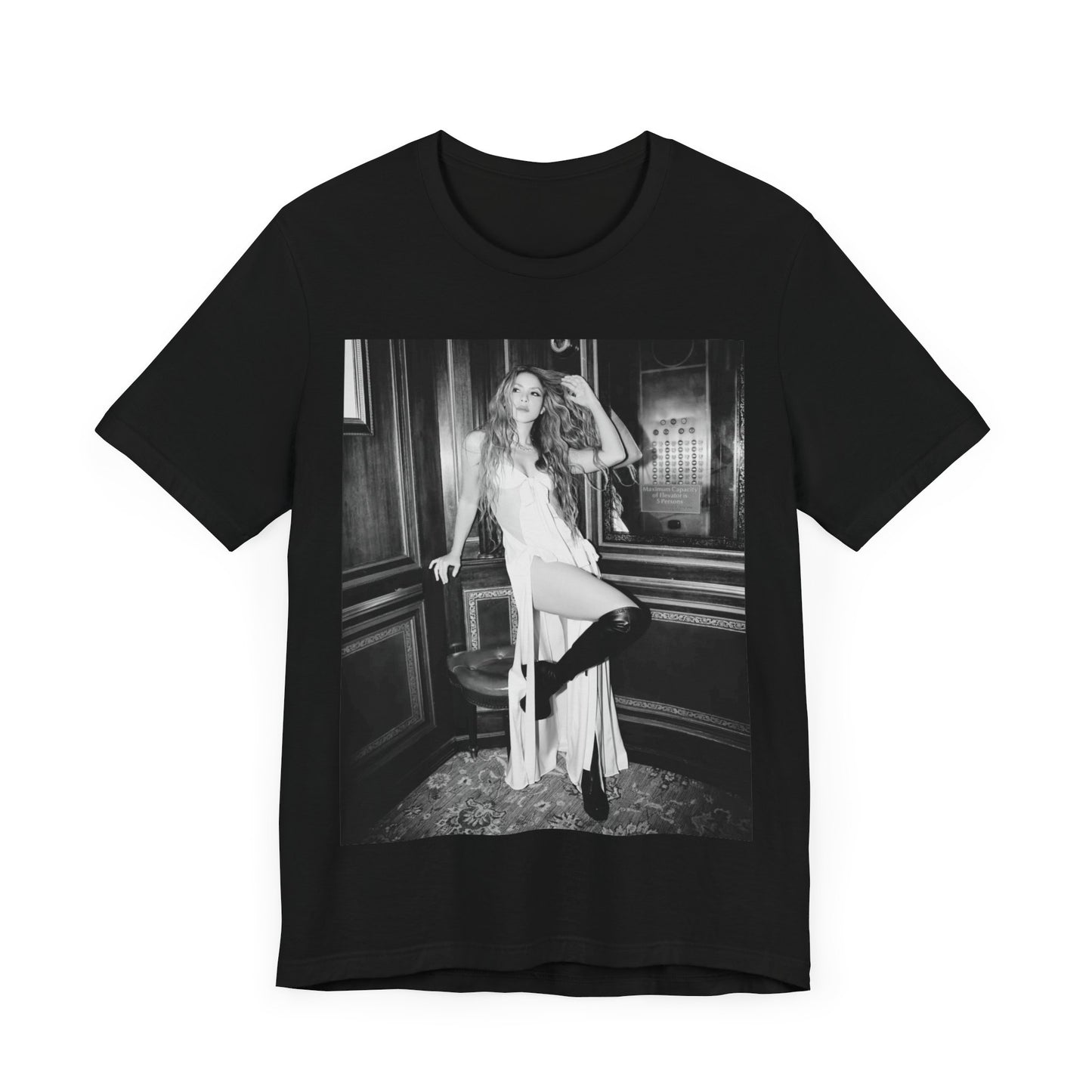 A black graphic t-shirt featuring a retro black and white monochrome graphic or photo of Shakira.
