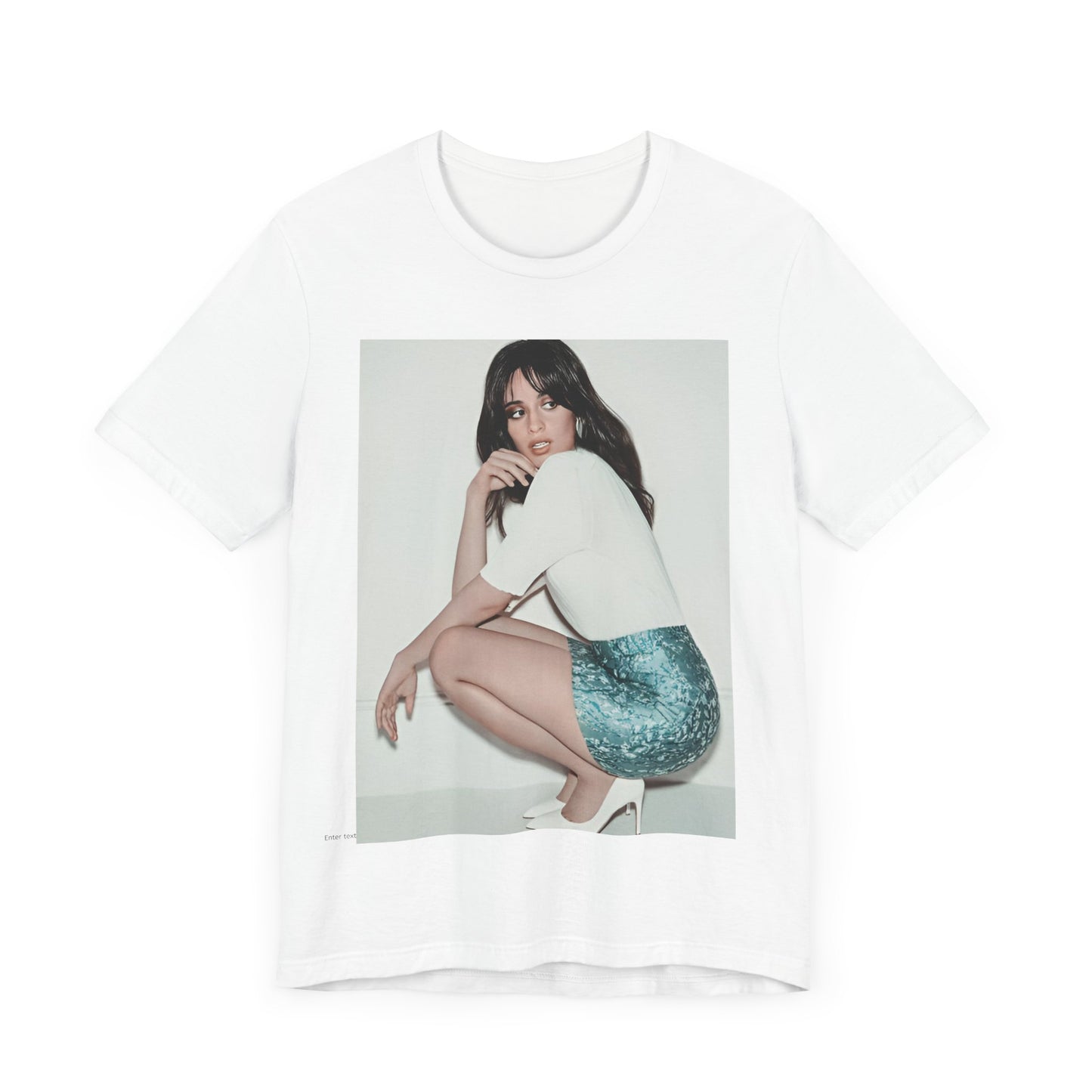 A black graphic t-shirt featuring a stylized graphic of Camila Cabello as a Latin pop princess.