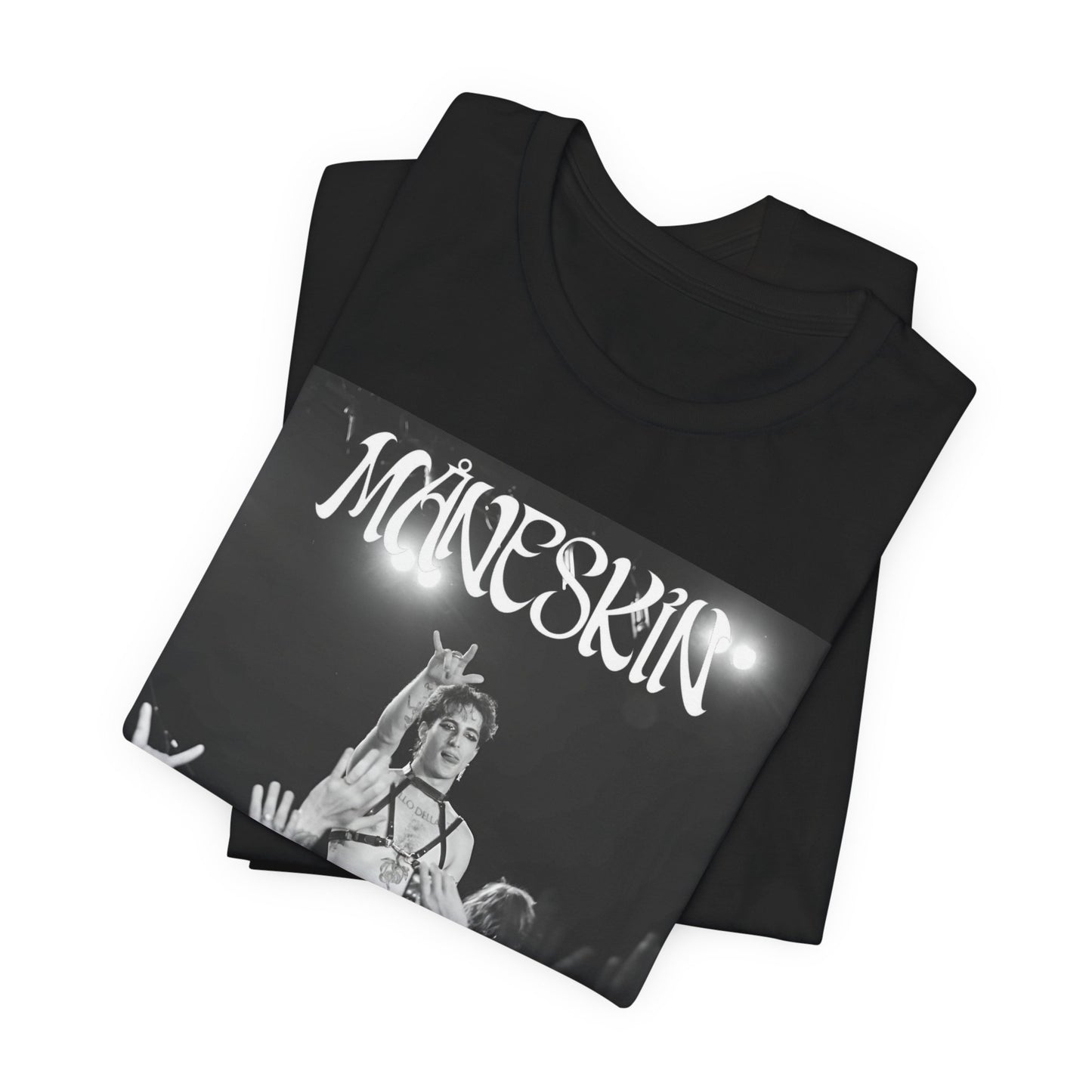 A black graphic t-shirt featuring a graphic or photo of Maneskin performing live.
