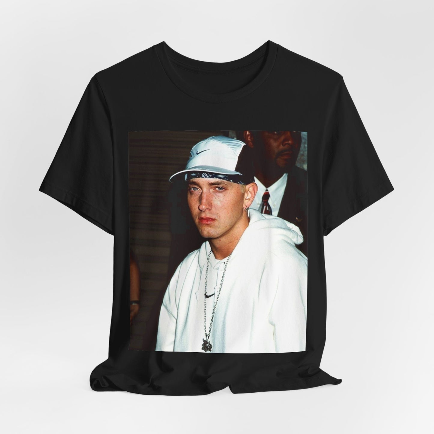 A black graphic t-shirt featuring a retro graphic or photo of Eminem in a backstage setting.