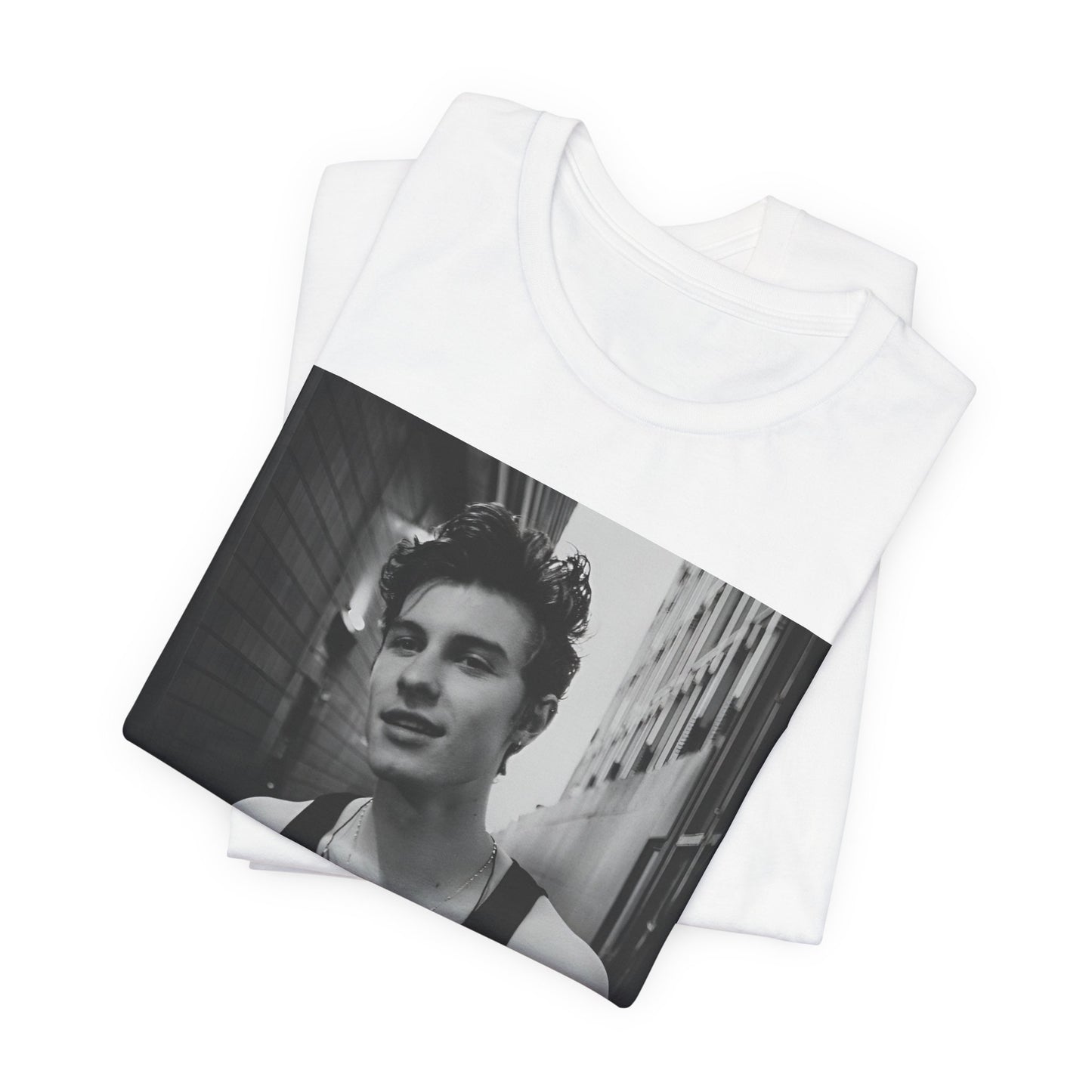 A black graphic t-shirt featuring a vintage black and white portrait graphic or photo of Shawn Mendes.