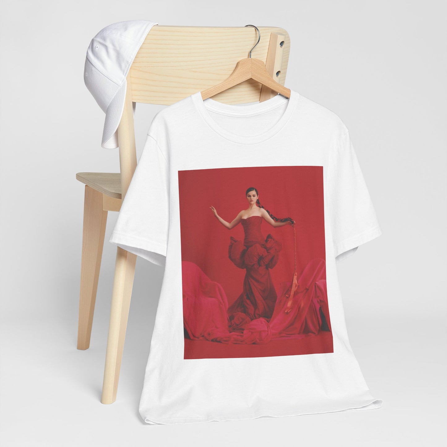 A black graphic t-shirt featuring a glam pop diva graphic of Selena Gomez.
