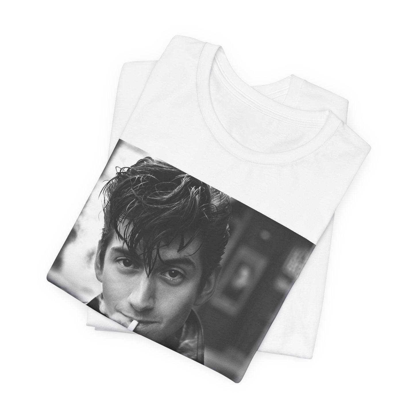 A black graphic t-shirt featuring a graphic of Alex Turner from Arctic Monkeys, in a rock star pose or setting.