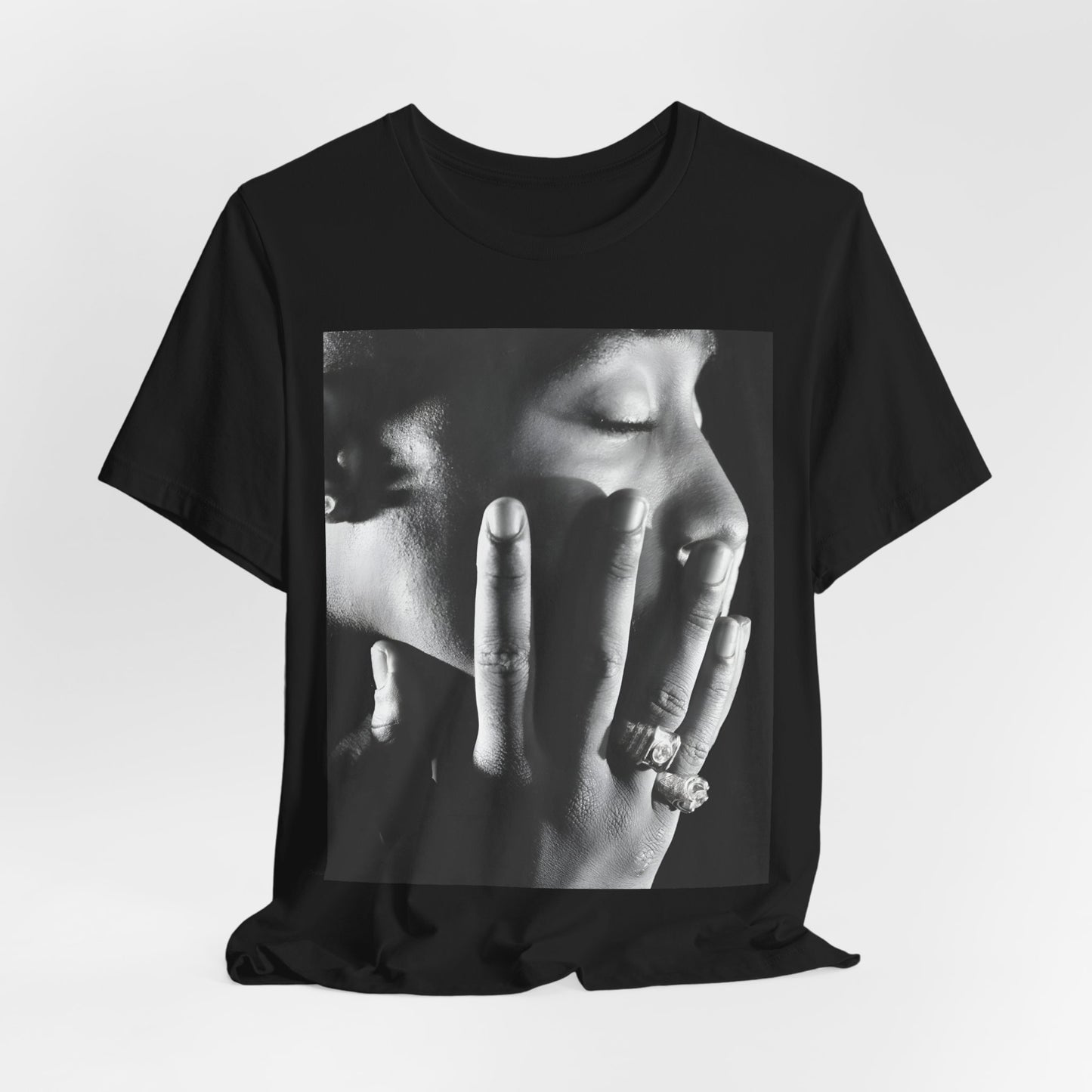 A black graphic t-shirt featuring an iconic West Coast swag graphic of Tupac.