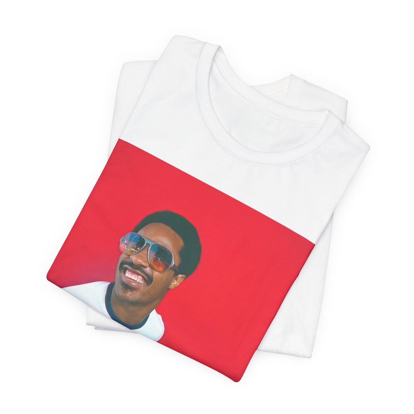 A black graphic t-shirt featuring a graphic of Stevie Wonder with a piano.