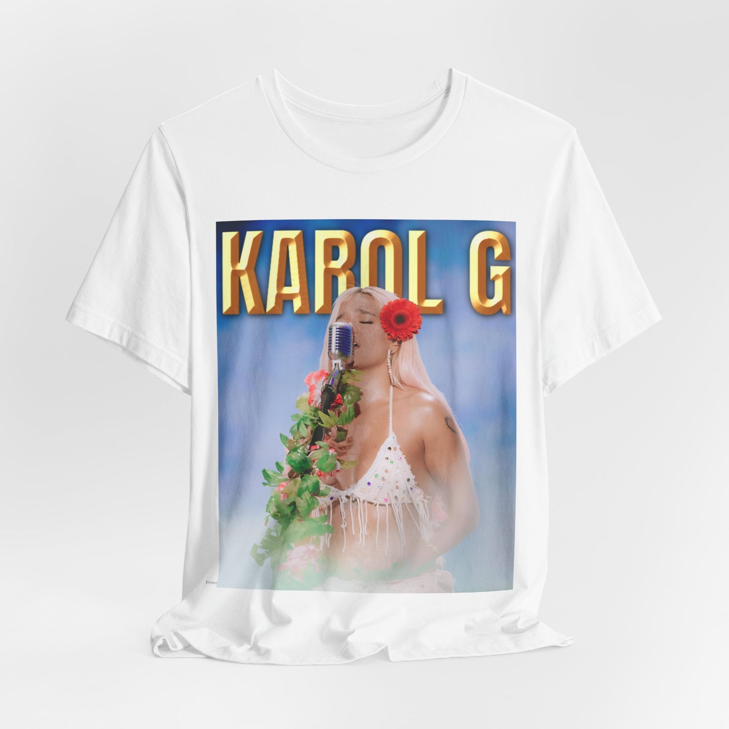 A black graphic t-shirt featuring a graphic of Karol G as a classic Latin pop queen.