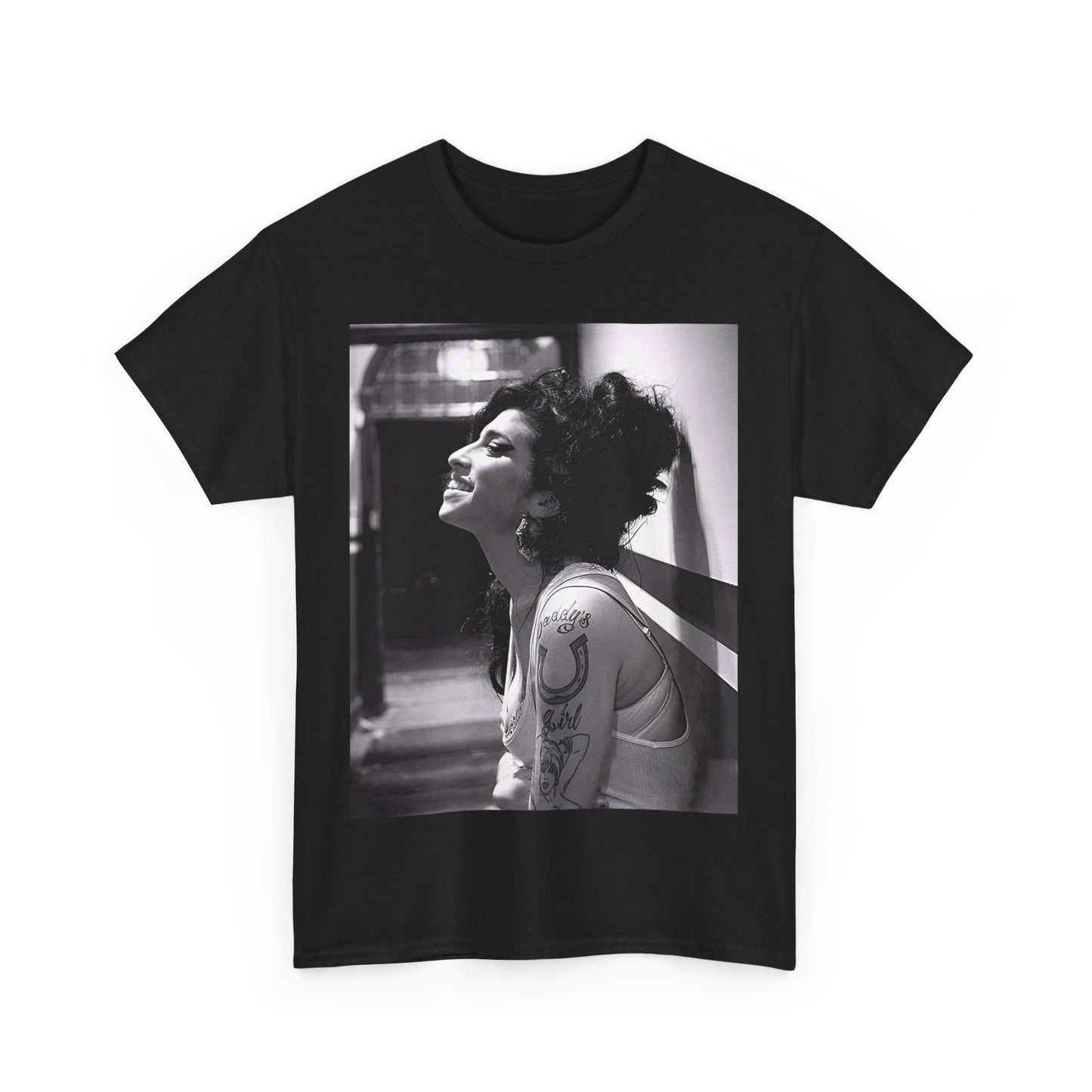 A black graphic t-shirt featuring a candid backstage photo of Amy Winehouse from her 'Back to Black' era, showing her in a relaxed setting.