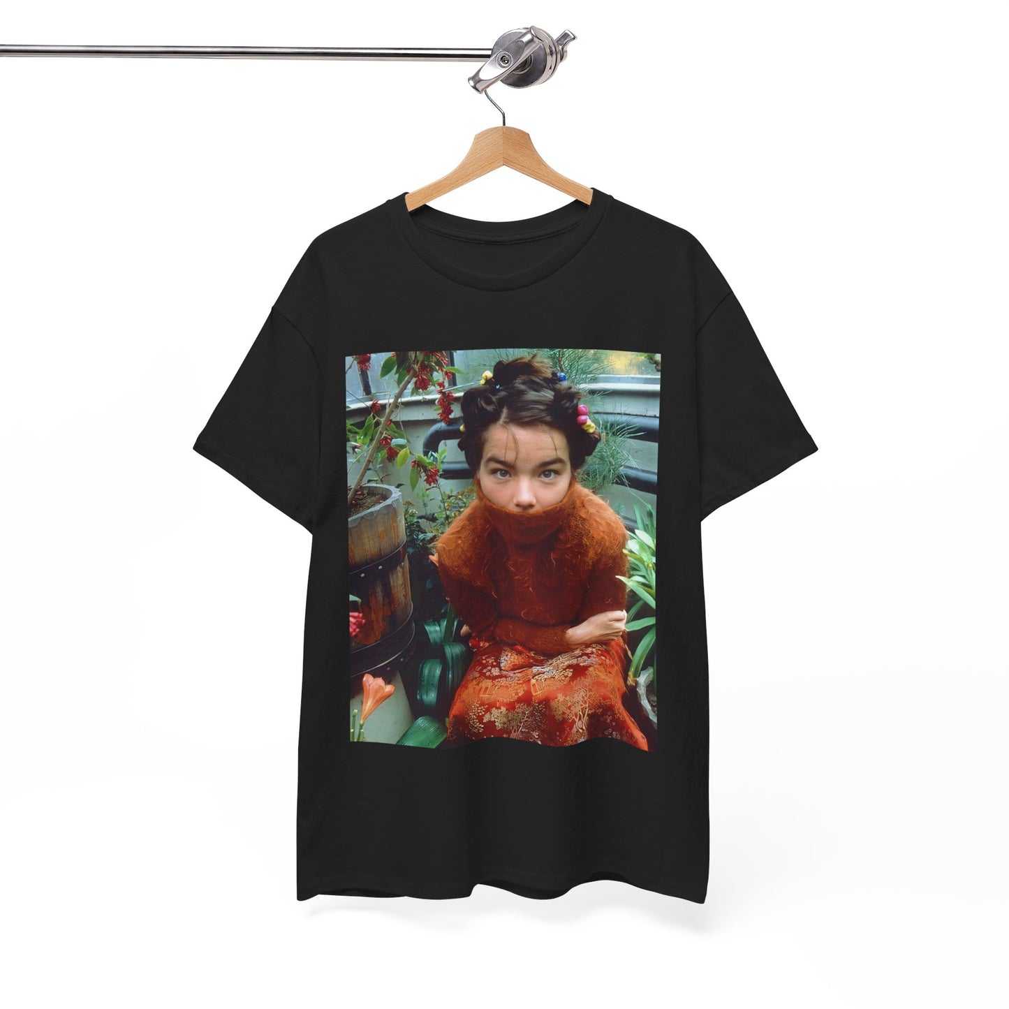 A black graphic t-shirt featuring a dynamic and 'fierce' graphic of Bjork, emphasizing her strong and confident presence.