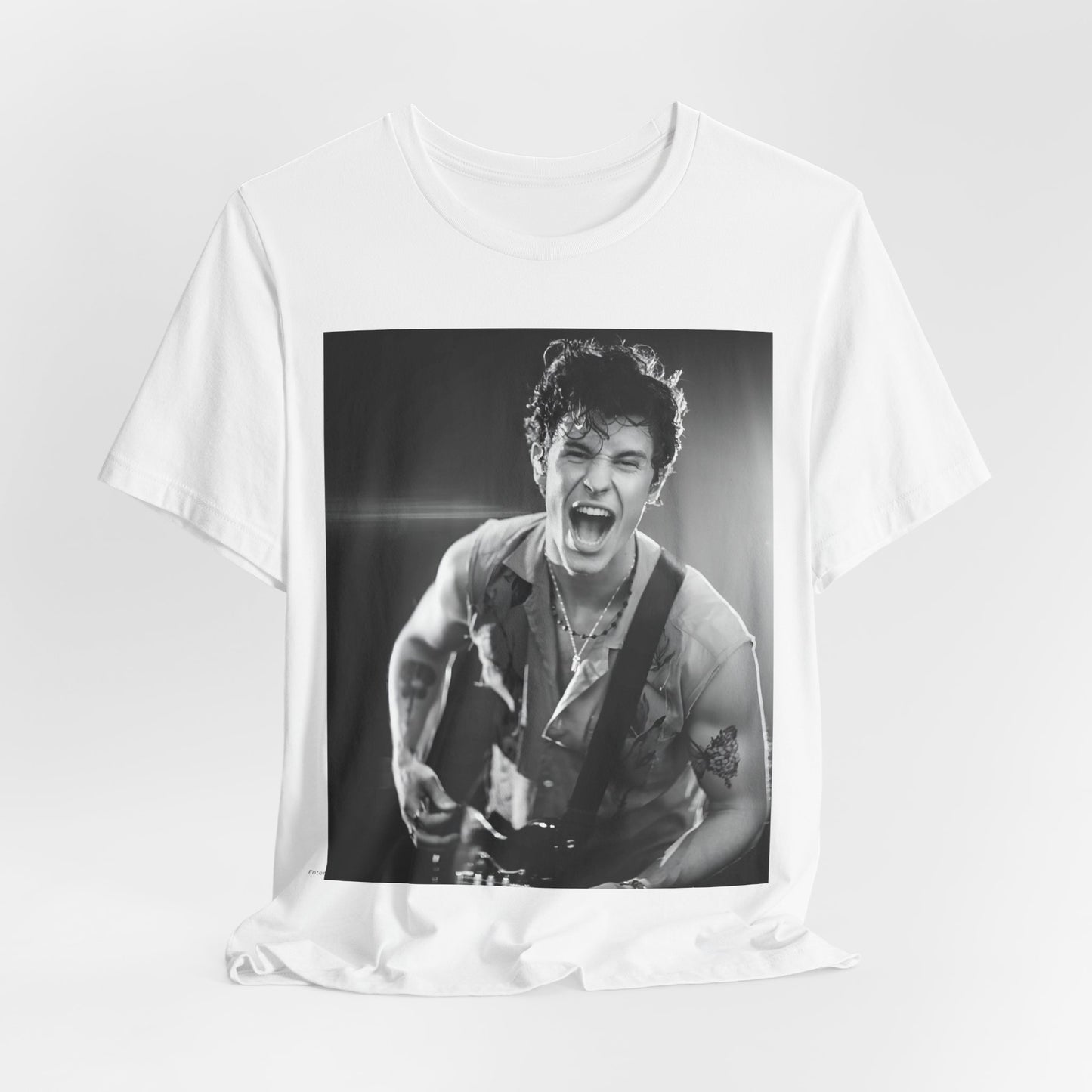 A black graphic t-shirt featuring a black and white photo of Shawn Mendes, emphasizing his charm.