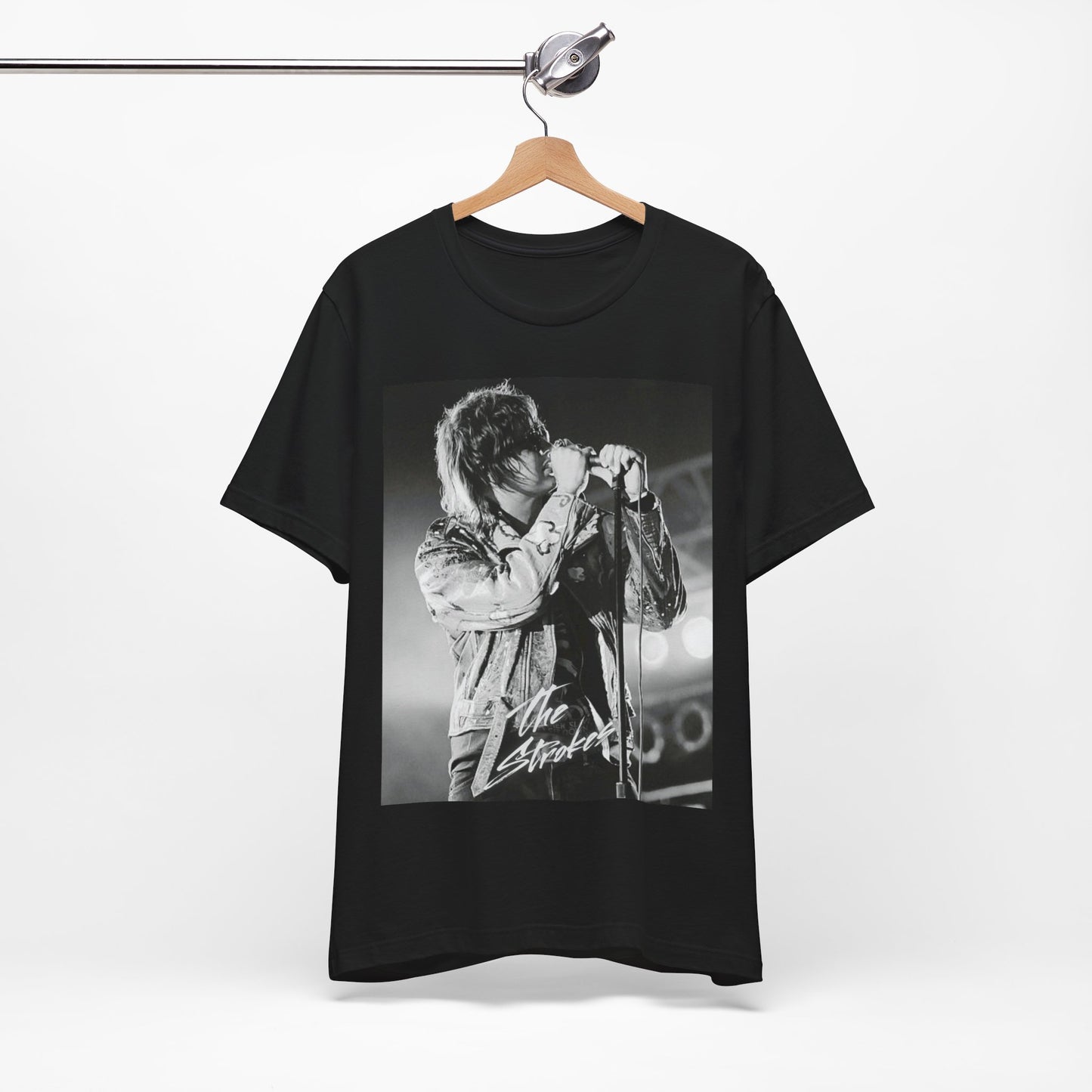A black graphic t-shirt featuring a vintage graphic related to The Strokes' 'Last Nite' song or era.