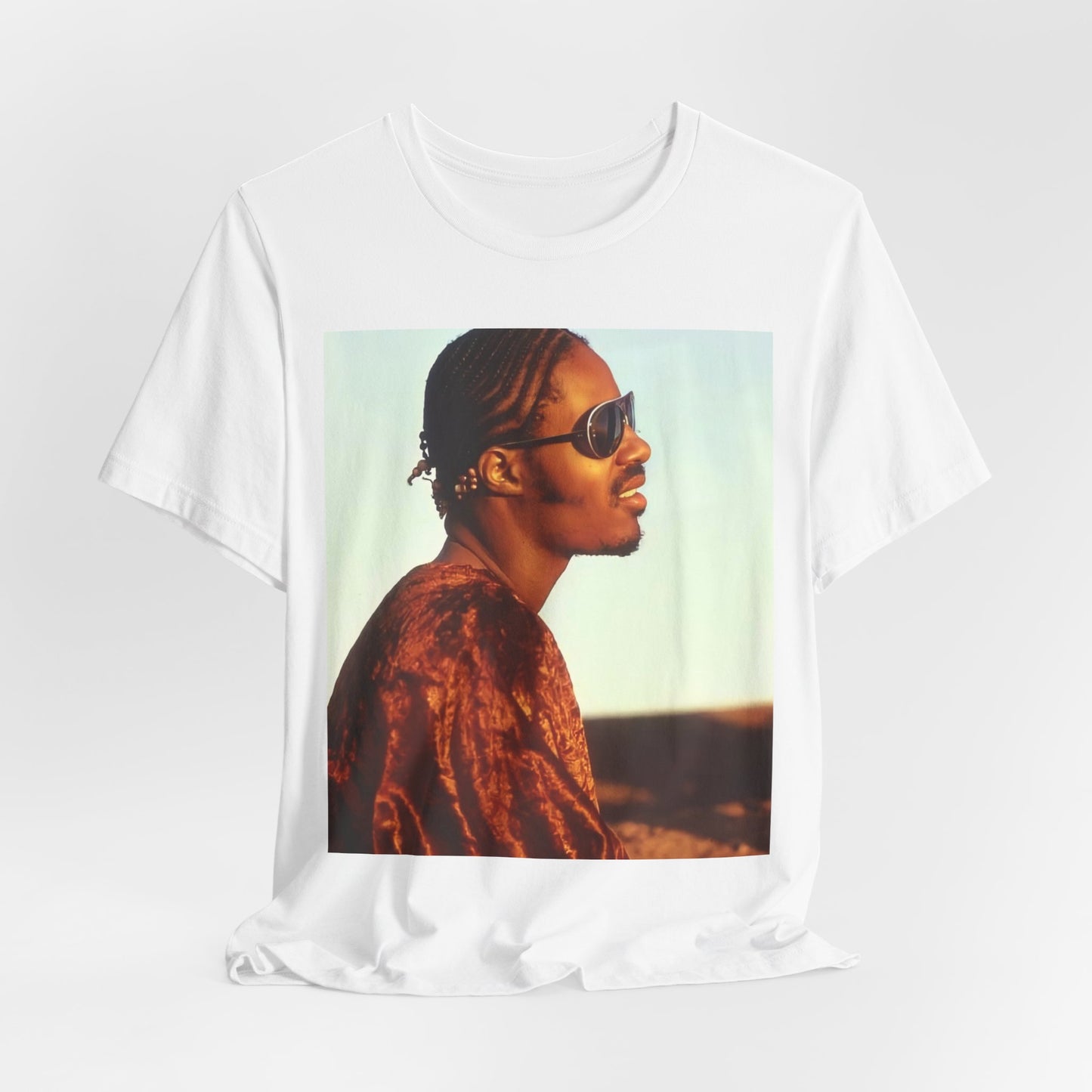 A black graphic t-shirt featuring a graphic of Stevie Wonder as an iconic style pop innovator.