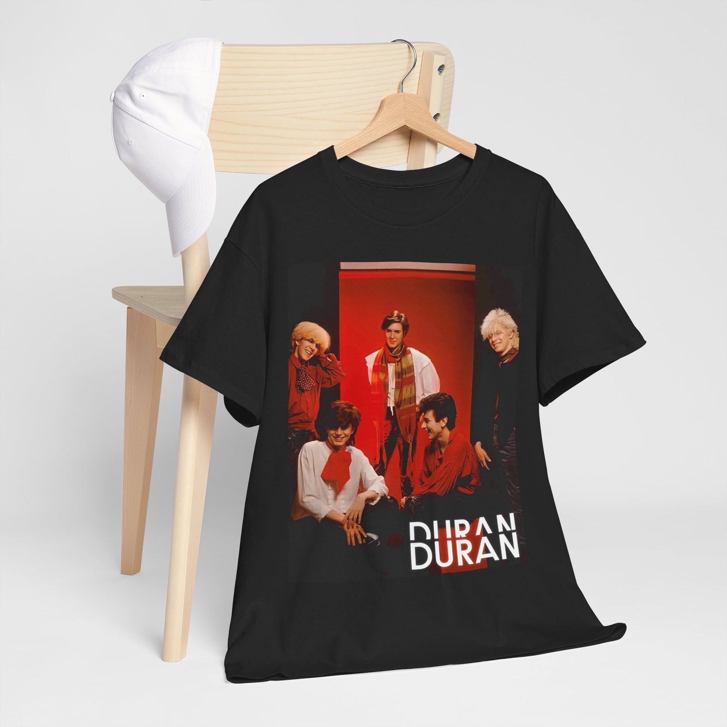 A black graphic t-shirt featuring an 80s aesthetic pop graphic of Duran Duran.