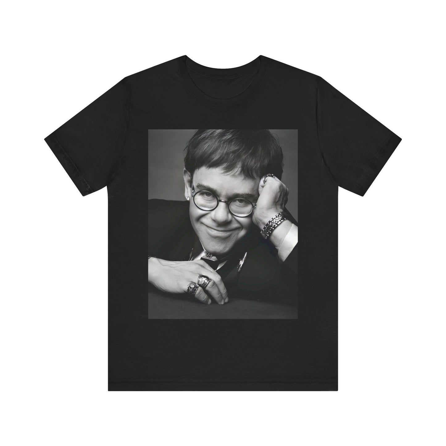 A black graphic t-shirt featuring a retro black and white photo portrait of Elton John.