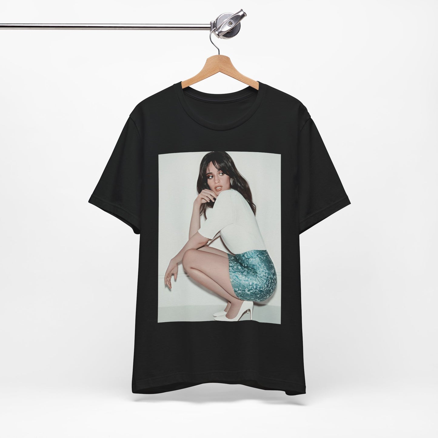 A black graphic t-shirt featuring a stylized graphic of Camila Cabello as a Latin pop princess.