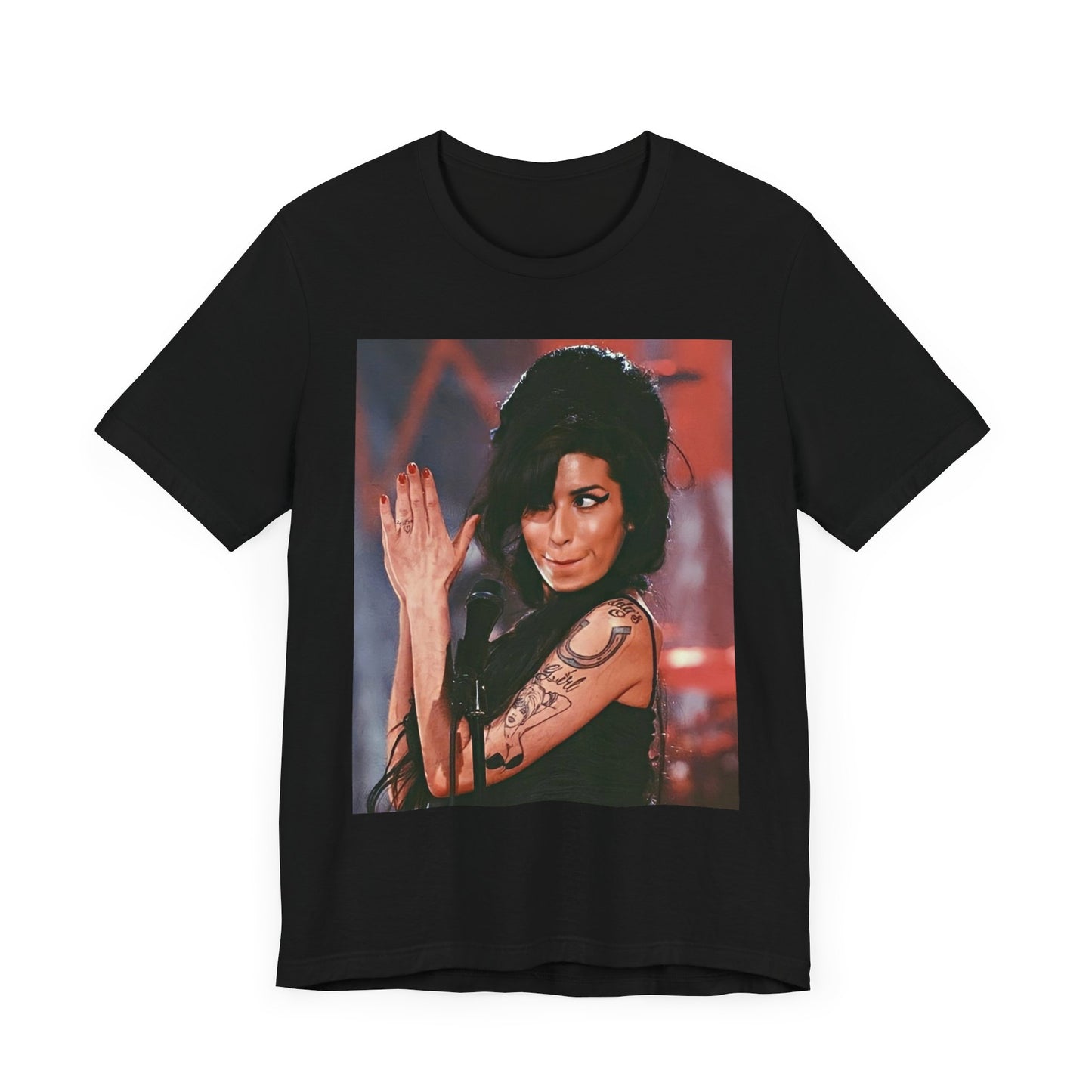 A black graphic t-shirt featuring a photo of Amy Winehouse performing live on stage in 2008, with her signature beehive and expressive singing.