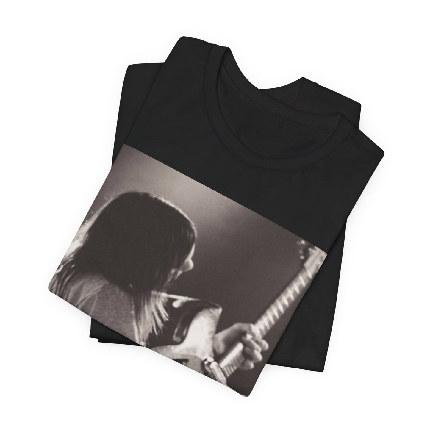 A black graphic t-shirt featuring a black and white graphic or photo of Tame Impala performing live on stage.