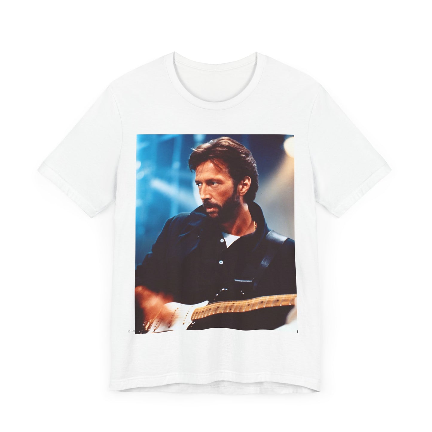 A black graphic t-shirt featuring a retro graphic or photo of Eric Clapton performing live on stage.