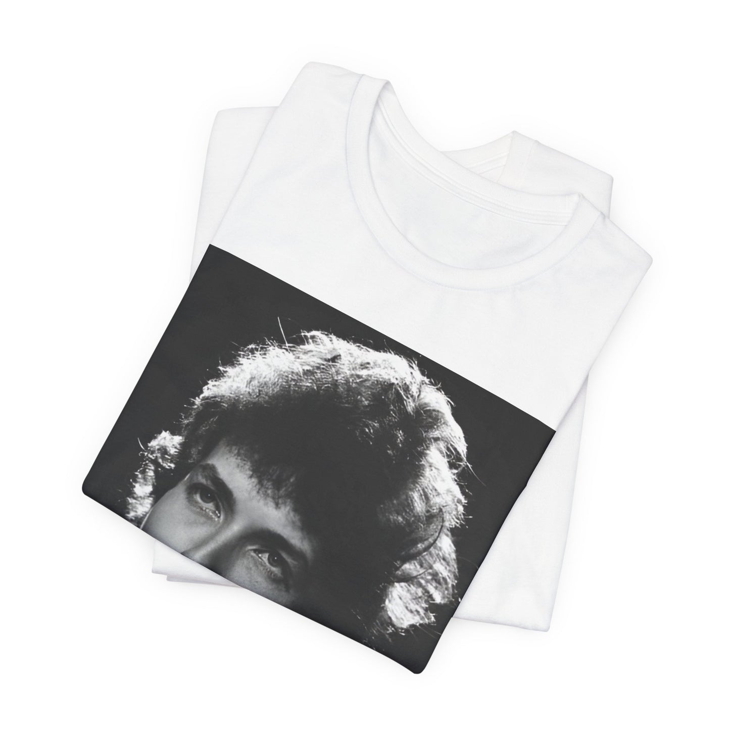 A black graphic t-shirt featuring a graphic of Bob Dylan from the 60s playing his harmonica.