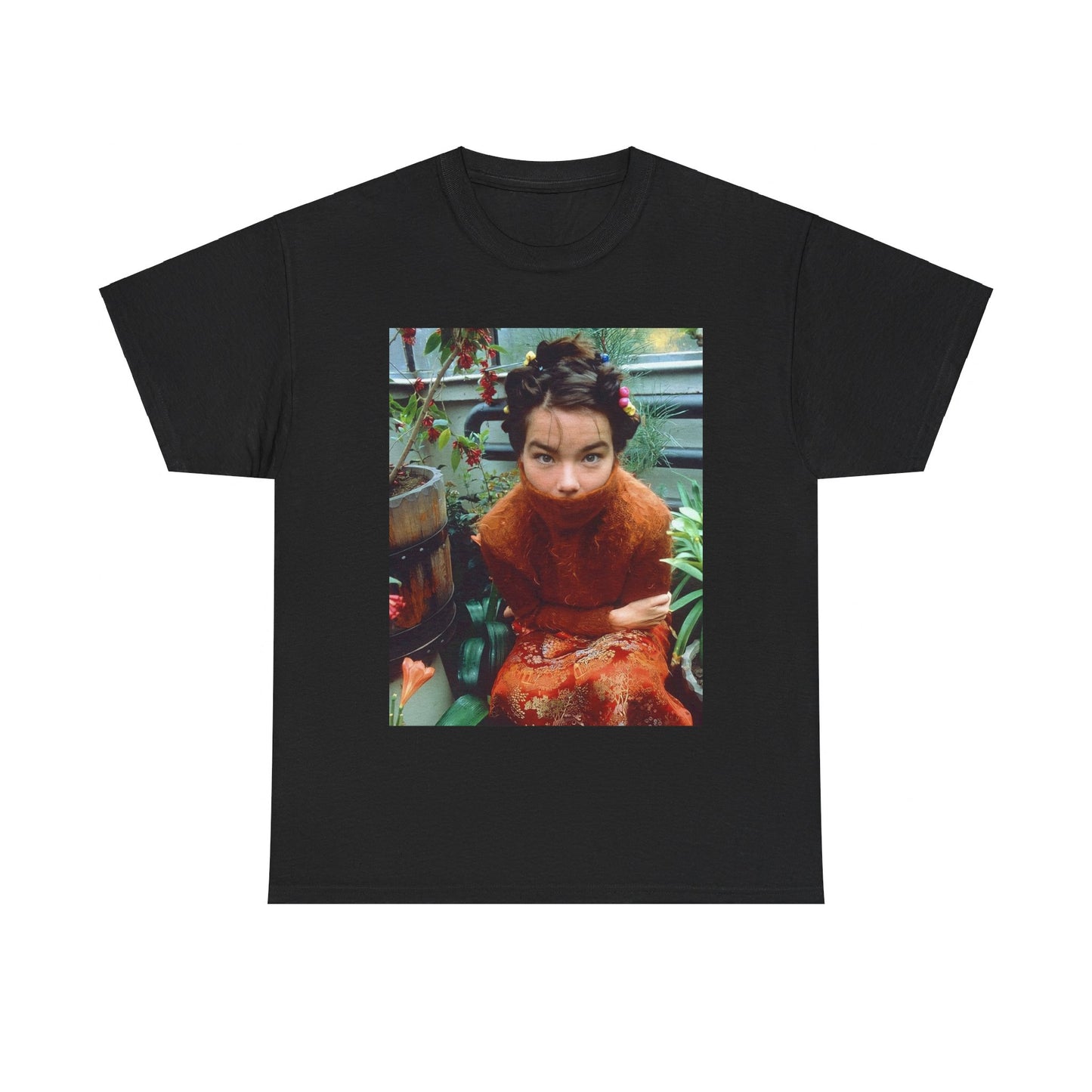 A black graphic t-shirt featuring a dynamic and 'fierce' graphic of Bjork, emphasizing her strong and confident presence.