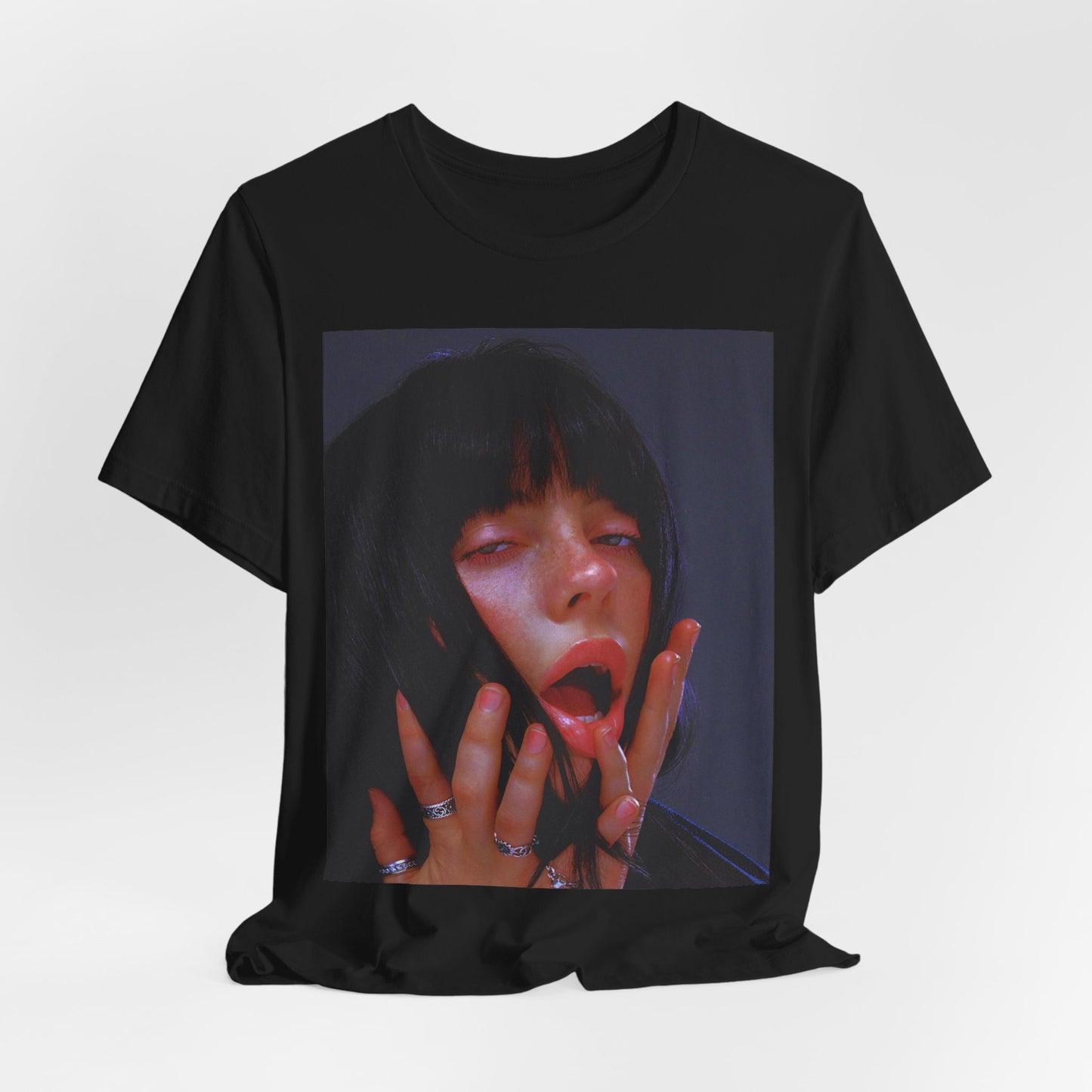 An intense, artistic photo of Billie Eilish with a bloody nose, conveying a sense of raw power, printed on a graphic t-shirt.