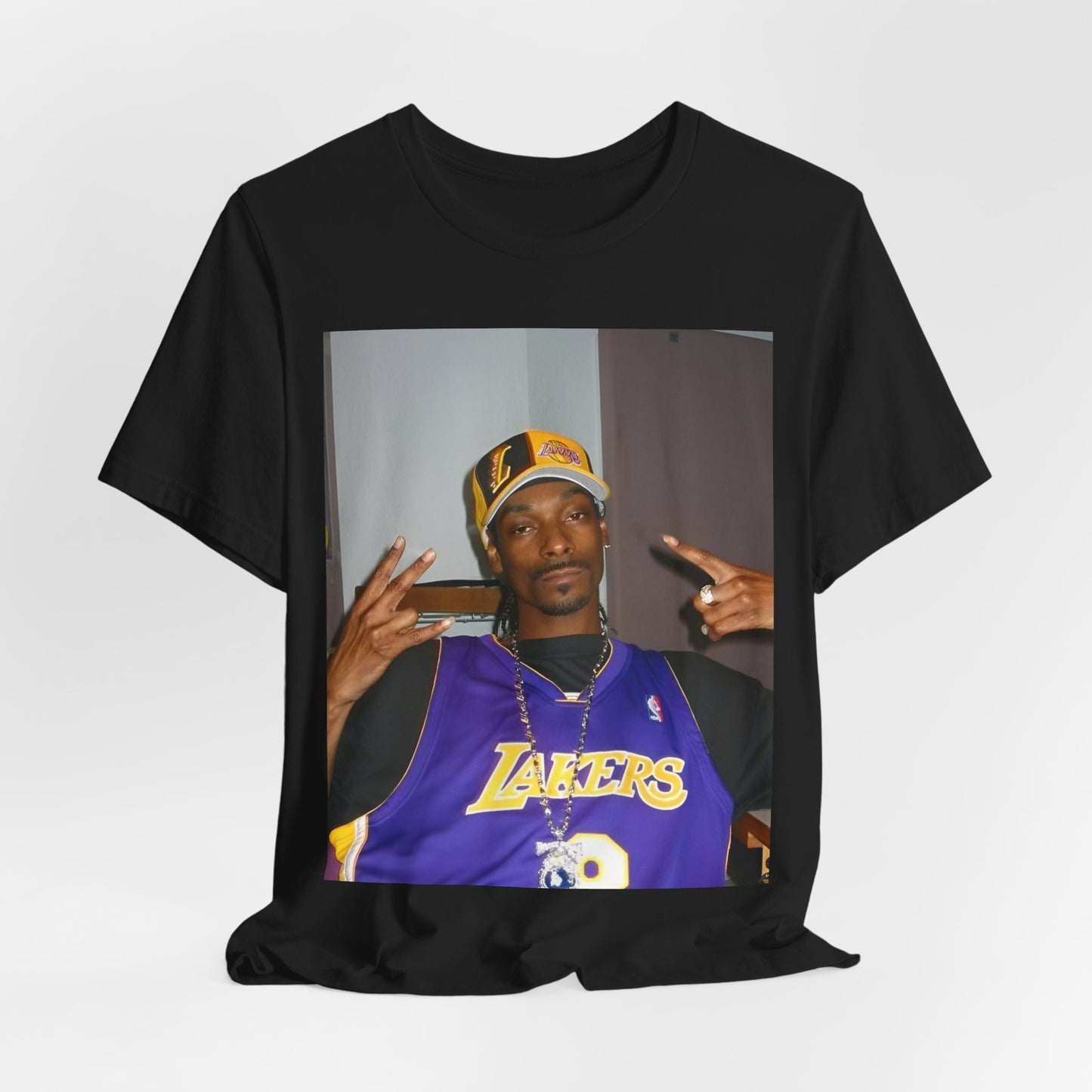 A black graphic t-shirt featuring a graphic of Snoop Dogg with Lakers branding or colors.