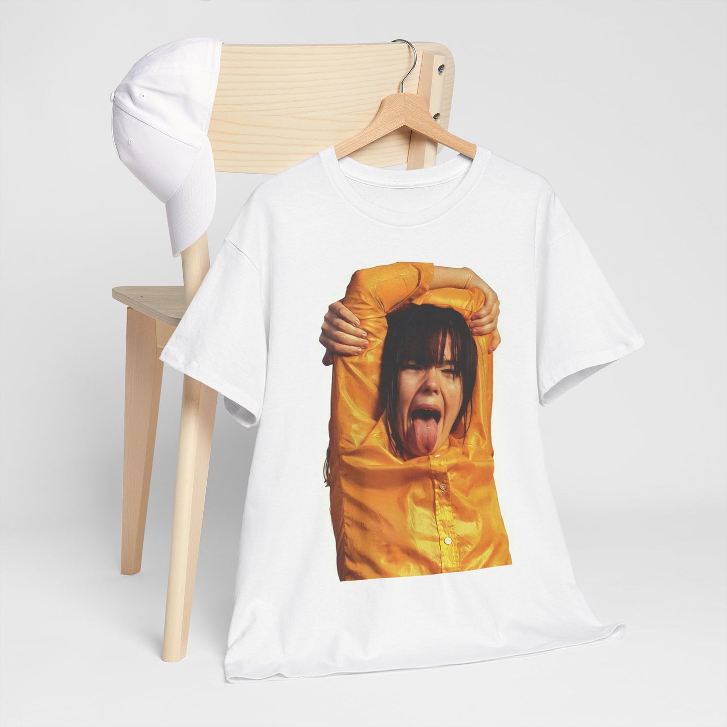 A black graphic t-shirt featuring a photo of Bjork with her tongue playfully sticking out.
