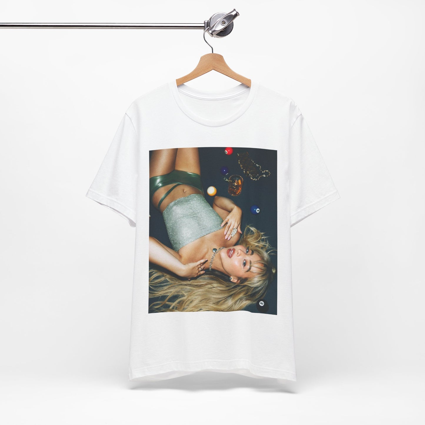 A black graphic t-shirt featuring a vintage pop icon graphic of Sabrina Carpenter.