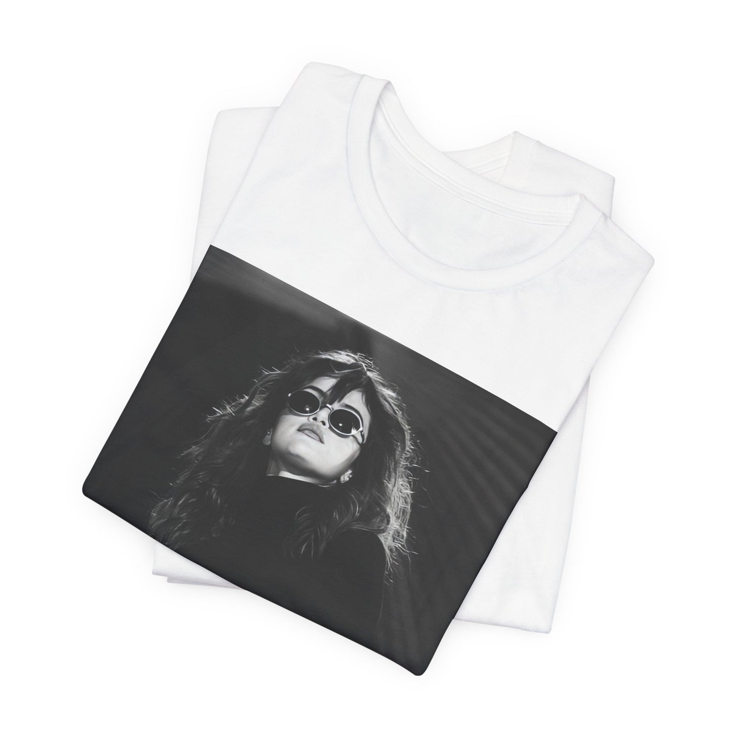 A black graphic t-shirt featuring a black and white, monochrome graphic or photo of Selena Gomez.