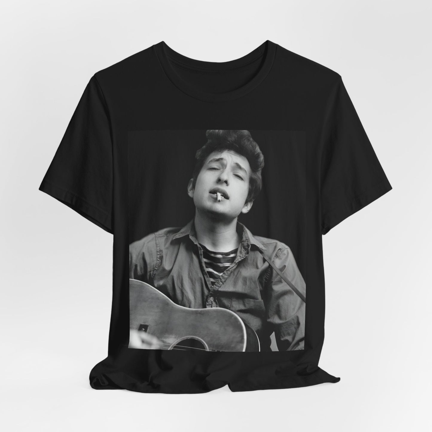 A black graphic t-shirt featuring a photo of Bob Dylan with his acoustic guitar.