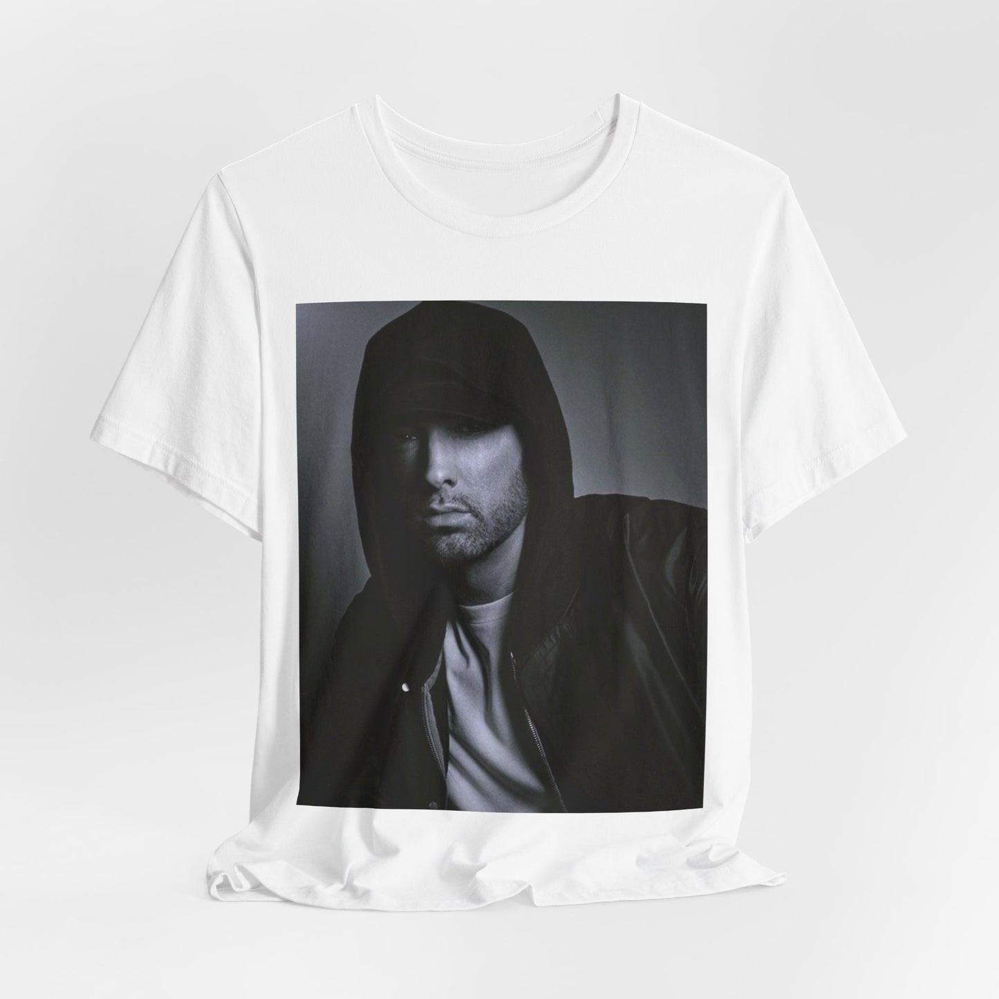 A black graphic t-shirt featuring a black and white, monochrome graphic or photo of Eminem.