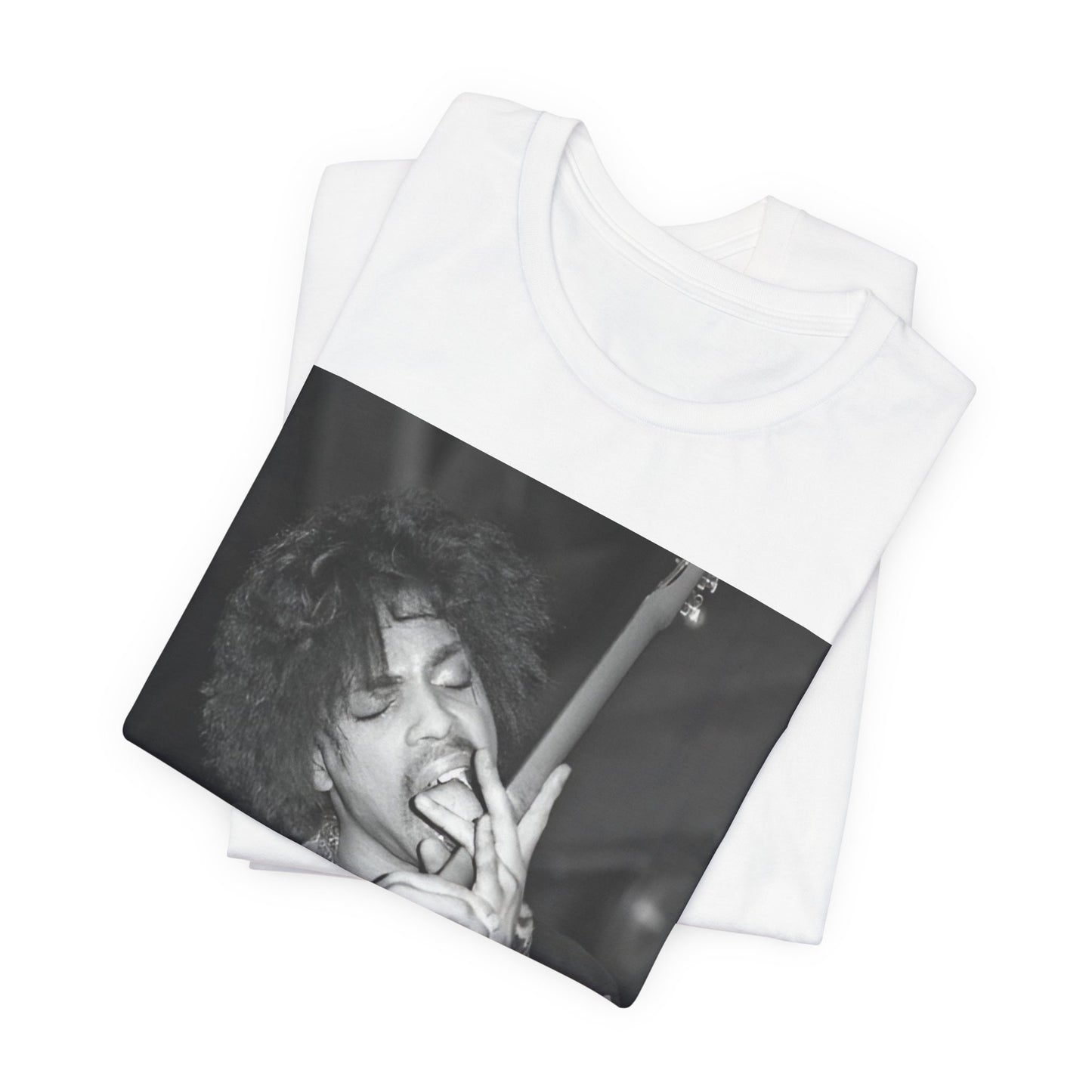 A black graphic t-shirt featuring a graphic or photo of Prince performing wildly on stage.