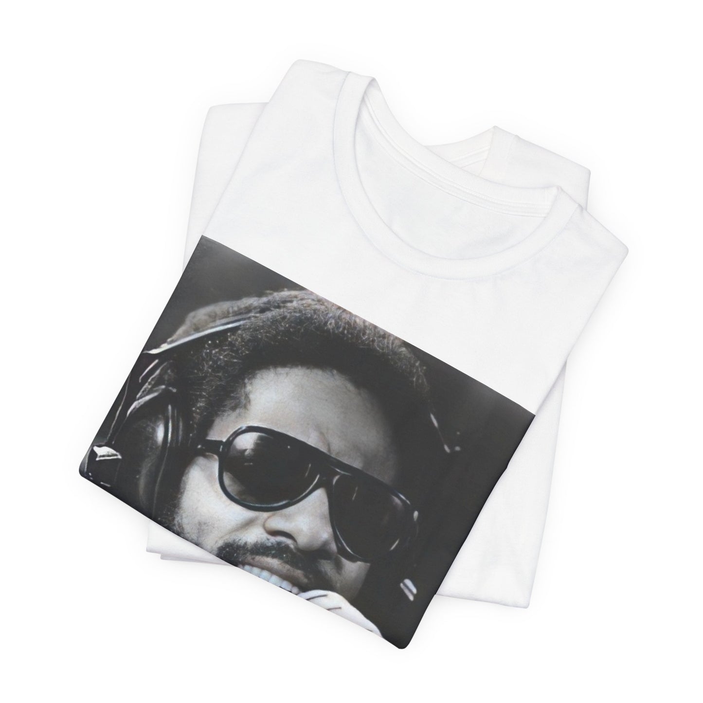 A black graphic t-shirt featuring a graphic of Stevie Wonder as a timeless visionary.