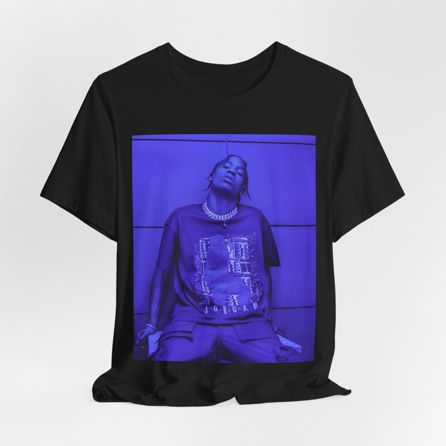 A black graphic t-shirt featuring a timeless trap star graphic of Travis Scott.