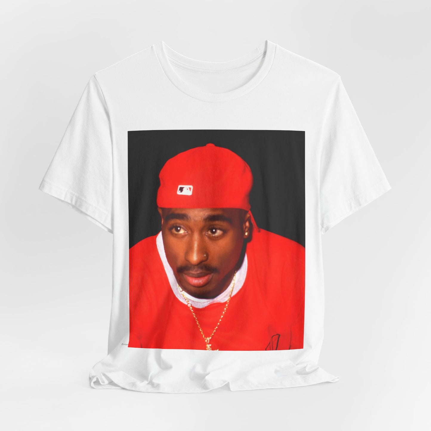 A black graphic t-shirt featuring a fierce graphic related to Tupac's 'California Love' song or era.