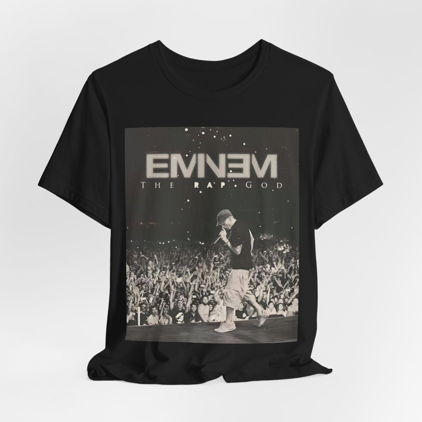 A black graphic t-shirt featuring a graphic or photo of Eminem performing live on tour.