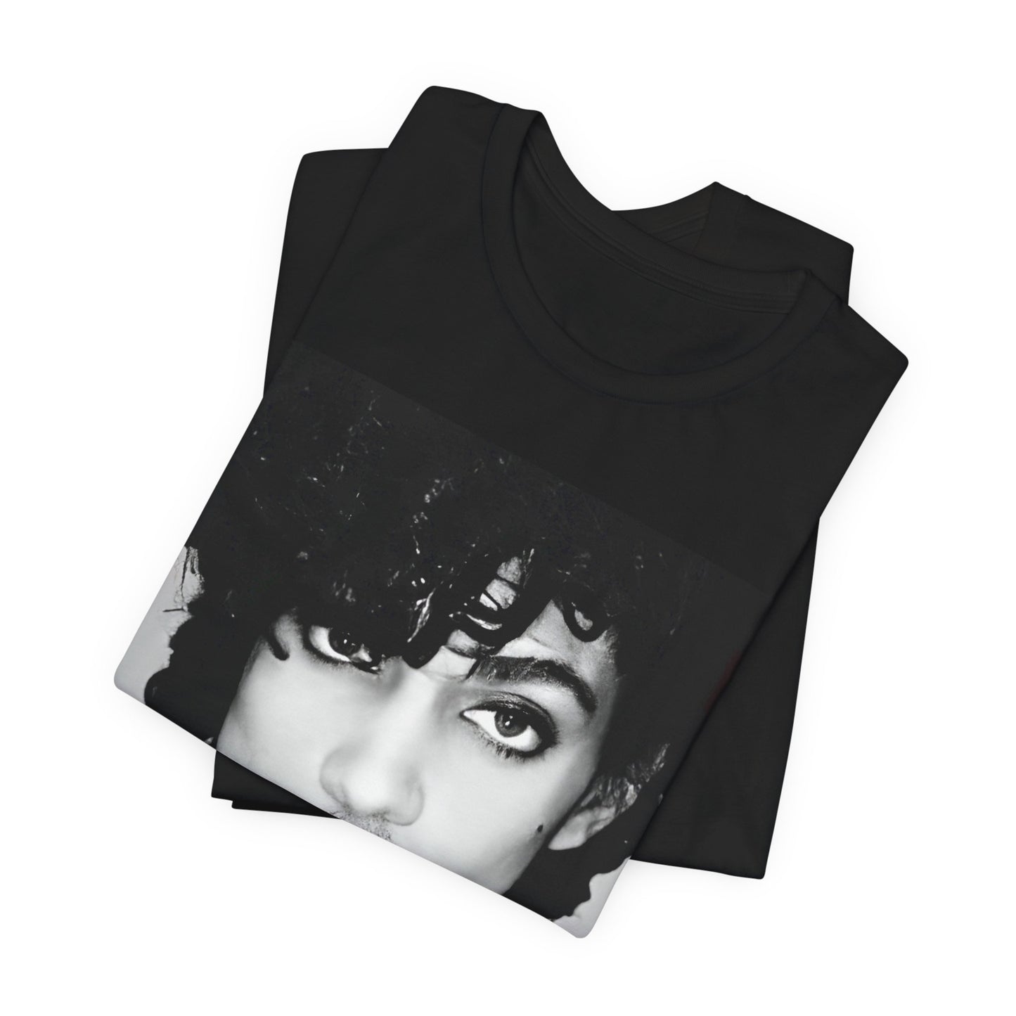 A black graphic t-shirt featuring a black and white photo portrait of Prince.