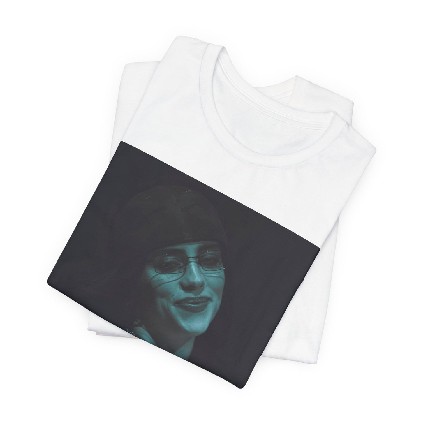 A powerful, close-up portrait of Billie Eilish with a direct and intense stare, printed on a graphic t-shirt.