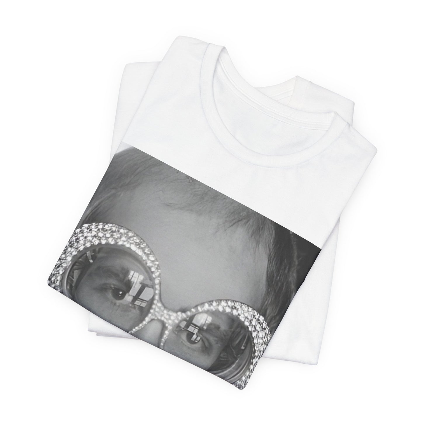 A black graphic t-shirt featuring a graphic of Elton John emphasizing his iconic glasses and fashion.