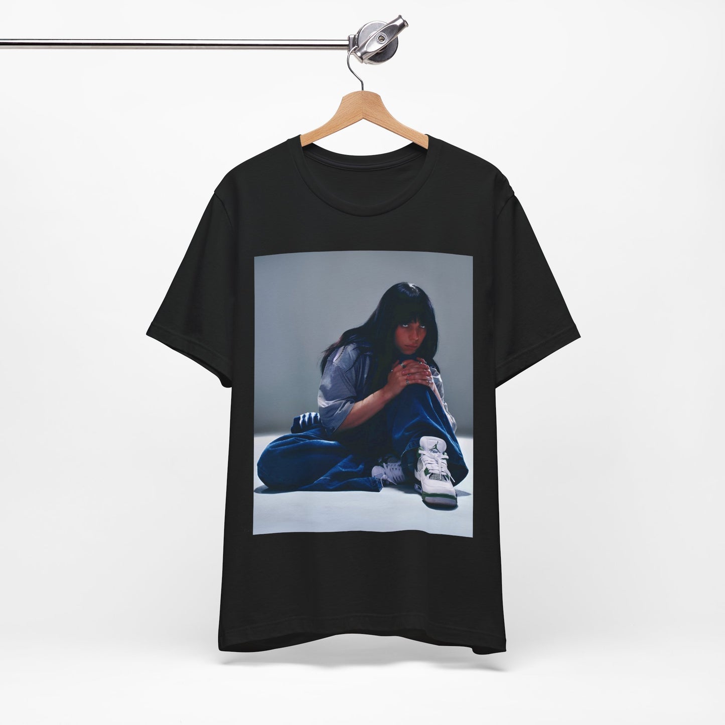 An artistic and slightly melancholic graphic t-shirt inspired by Billie Eilish's song "Lovely," featuring soft colors and a dreamy style.