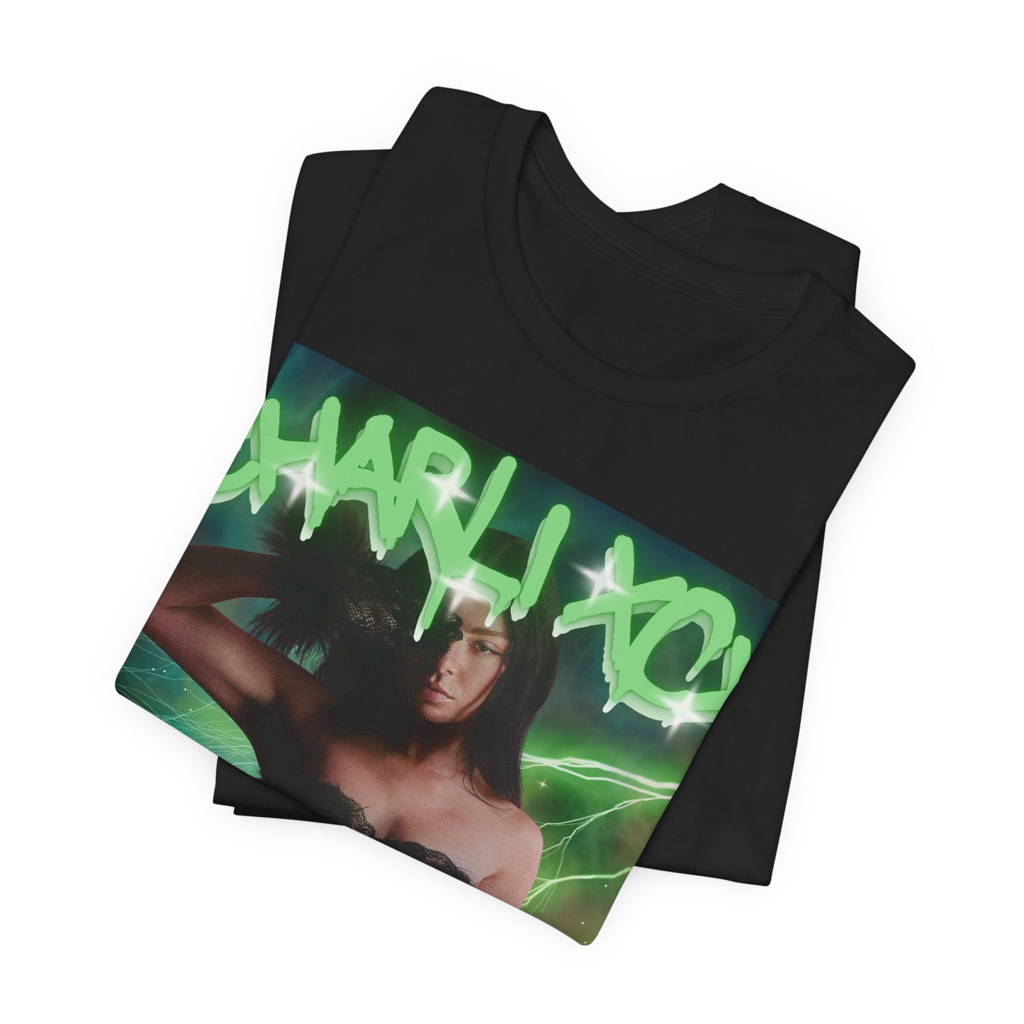 A black graphic t-shirt featuring a retro green neon graphic of Charli XCX's signature.