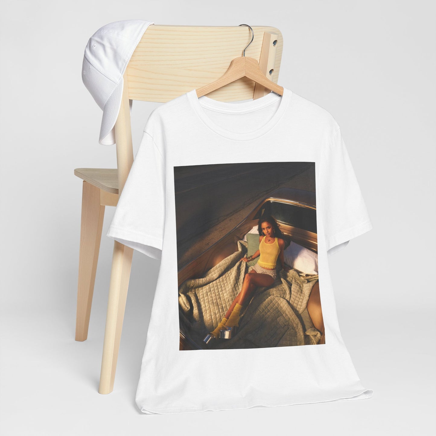 A black graphic t-shirt featuring a graphic of Tyla as an African fashion icon.