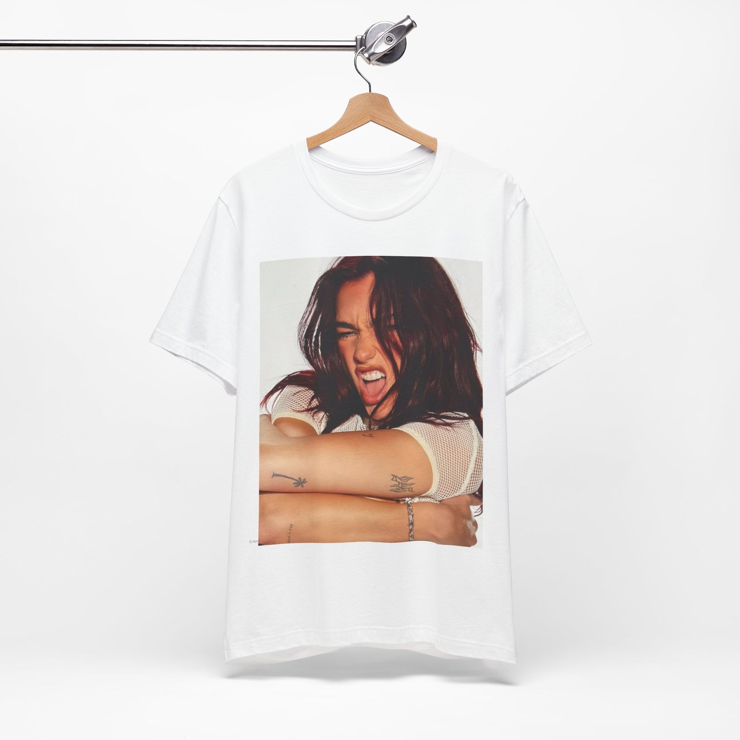 A black graphic t-shirt featuring a bold disco pop graphic of Dua Lipa as a superstar.